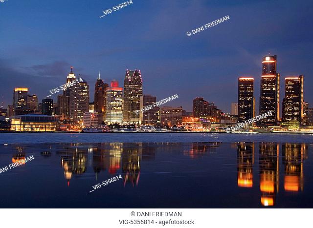 Skyline of downtown Detroit, Michigan, USA illuminated at night. Ice can be seen floating in the Detroit River. Detroit is known as The Motor City, The D