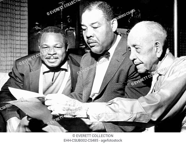 Conferring on the possibility of an Archie Moore vs. Gene Fuller. L-R: Moore, matchmaker Joe Lewis, and Moore's manager Jack 'Doc' Kearns