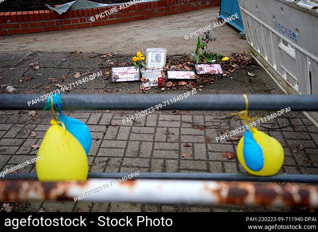 23 February 2023, Hamburg: Blue and yellow balloons, the colors of the Ukrainian national flag, hang from a barrier in front of the Consulate General of the...