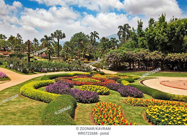 Magnificent flower beds, green lawns and tropical trees