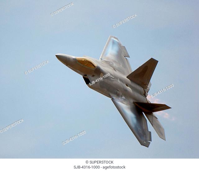 Condensation Forms on The Leading Edge of An F-22 Raptor's Wings During A High Speed Turn