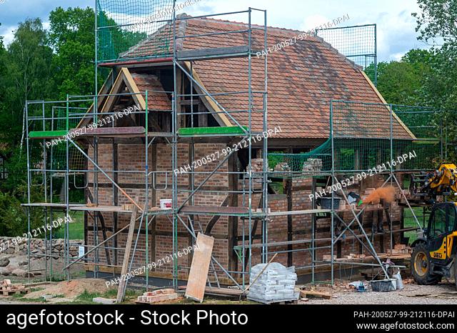 13 May 2020, Saxony-Anhalt, Diesdorf: Workers wall the walls of the village church of Klein Chüden. The village church of Klein Chüden had been demolished in...