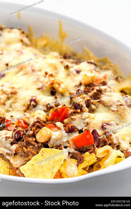 nachos with minced beef , red pepper and beans