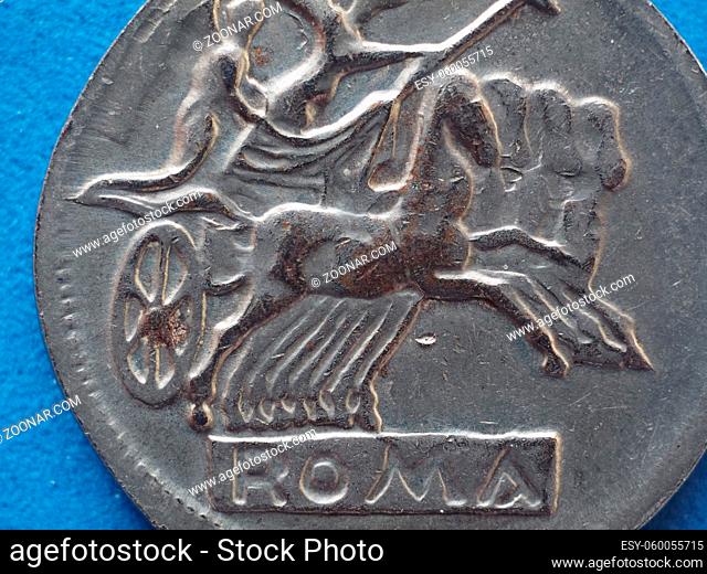 close macro detail of ancient roman coin with horses and biga (chariot)