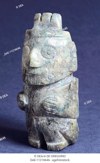 Green stone anthropomorphic figurine originating from the Temple Mayor of Tenochtitlan (Mexico). Aztec Civilization 15th Century