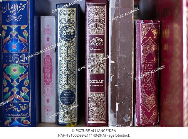 02 October 2018, Saxony, Dresden: 02 October 2018, Germany, Dresden: Numerous editions of the Koran can be found on a shelf in the mosque at the Islamic Centre...
