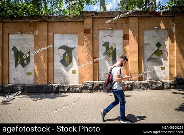 Armenia, Yerevan, Armenian Alphabet Wall by the Matenadaran library, with people, no releases