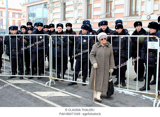 75-year-old Lilya Ivanova stands in front of policemen during a demonstration in Moscow, Russia, 26 February 2017. Thousands of opposition members demonstrated...