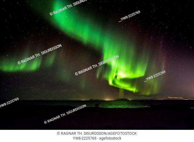 Aurora Borealis or Northern Lights by the town of Gardur, Reykjanes Peninsula, Iceland