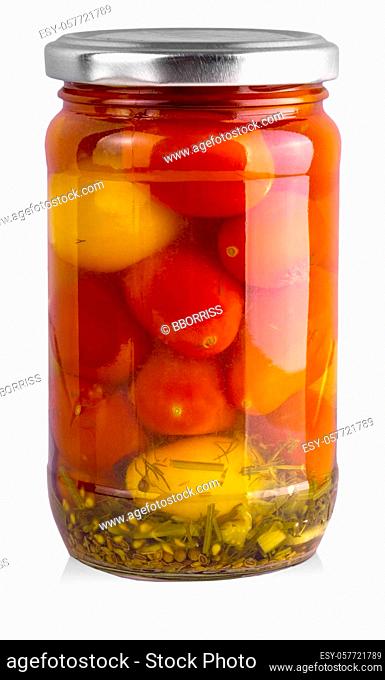 Pickled red and yellow tomato in glass isolated on white background