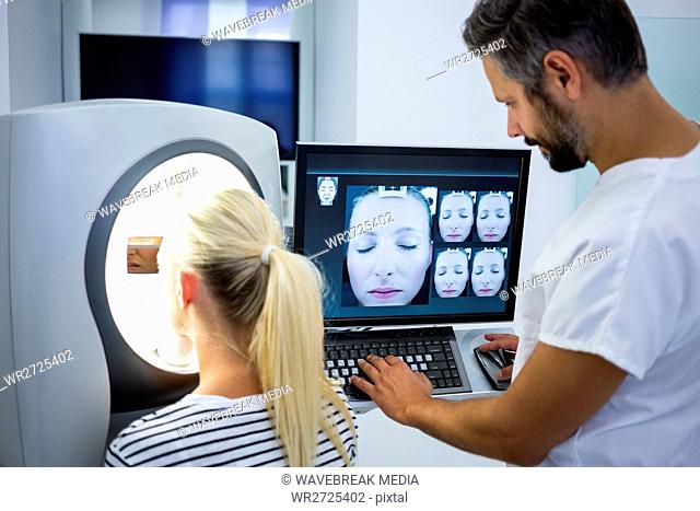 Woman receiving aesthetic laser scan