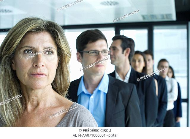 Business associates standing in a row