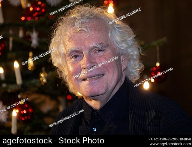 06 December 2023, Bavaria, Munich: Sir Simon Rattle, chief conductor of the Bavarian Radio Symphony Orchestra, is coming to the Bavarian Broadcasting...