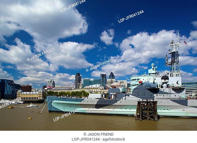 England, London, Southwark. HMS Belfast, originally a Royal Navy light cruiser, permanently moored in London on the River Thames with the City of London and the...