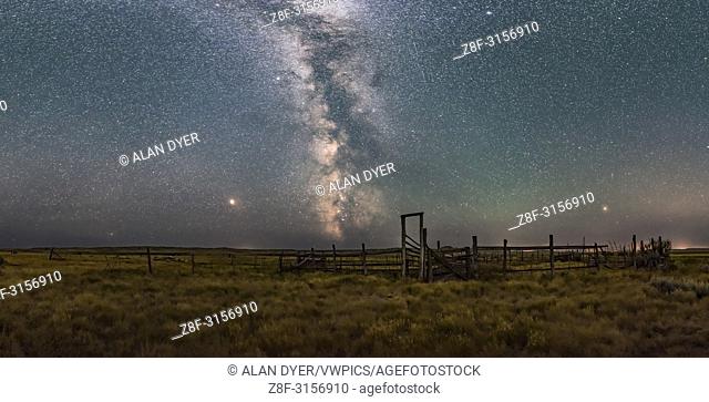A partial panorama of the summer sky and Milky Way over the historic 76 Ranch Corral in the Frenchman Valley, in Grasslands National Park, Saskatchewan