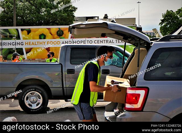 The Central Texas Food Bank hosts a drive through ""contact free"" emergency food distribution at Austin Community College Highland Campus on 03/17/2020