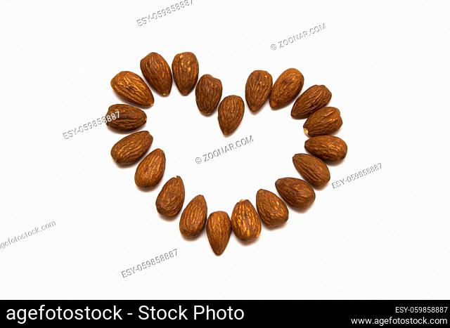 Almonds nuts heart isolated on a white background