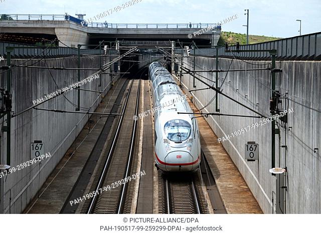 06 May 2019, Hessen, Frankfurt/Main: An Intercity Express (ICE) passes under a bridge near the airport. Photo: Silas Stein/dpa