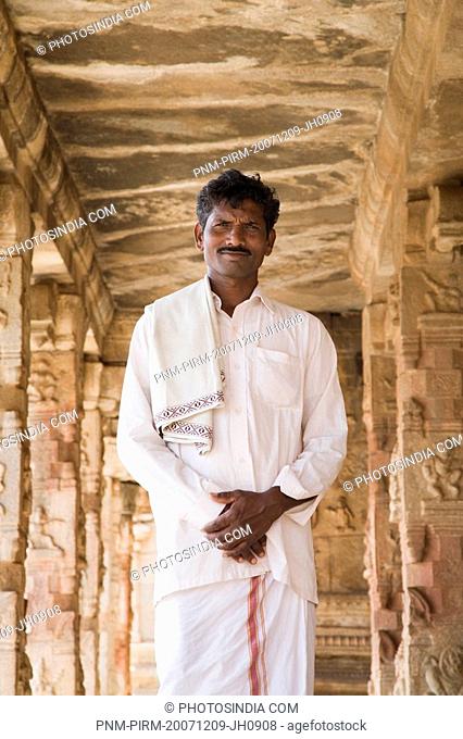Man standing in a temple, Krishna Temple, Hampi, Karnataka, India