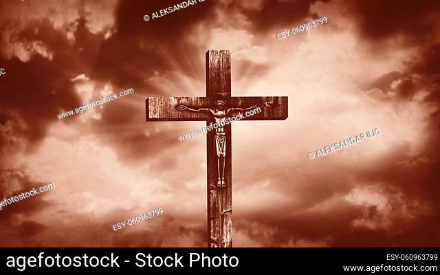 Jesus Christ crucified at Golgotha hill outside ancient Jerusalem. The crucifixion of Christ with stormy clouds in the sky. Vintage film look