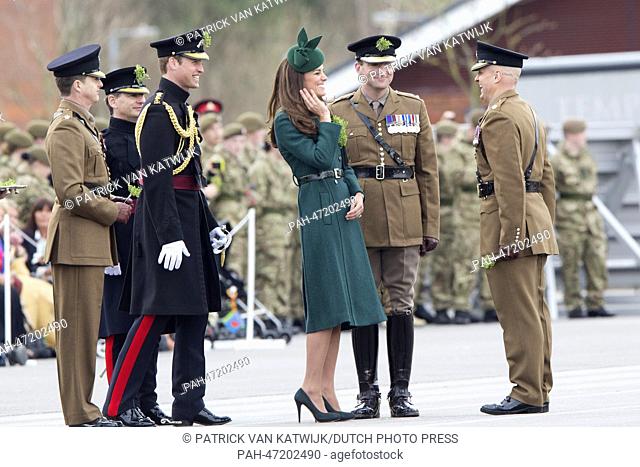 William, Duke of Cambridge and Catherine, Duchess of Cambridge attend the traditional sprigs of shamrocks to the officers and Irish guards at St
