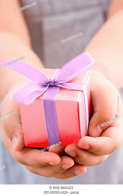 Girl holding a small gift