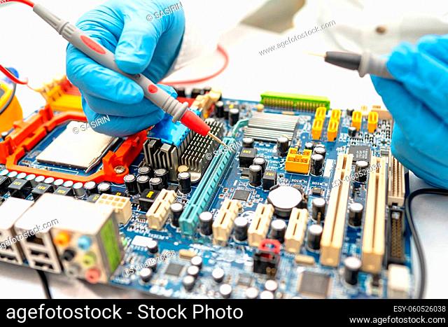 Technician repairing micro circuit main board computer electronic technology, hardware, mobile phone, upgrade, cleaning concept