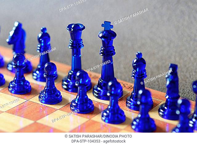Game sport Chess in blue colored plastic pieces