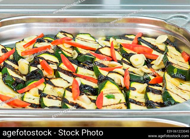 An antipasti buffet with very appetizing grilled zucchini in an Italian restaurant