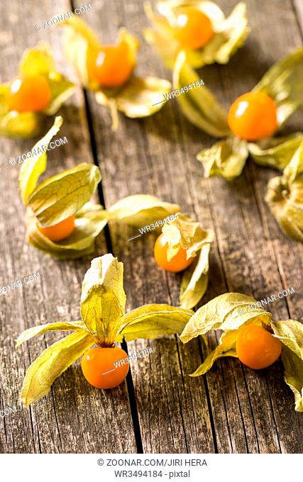 Physalis peruviana fruit on old wooden table