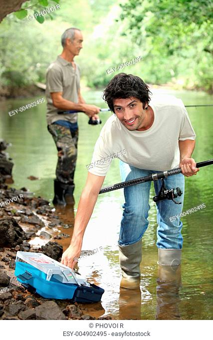 Men fishing in a river