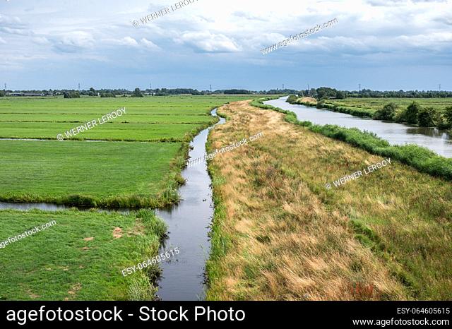 Green lawns and canals at the natural flood zones of the Reeuwijkse plassen in Reeuwijk, Holland, The Netherlands