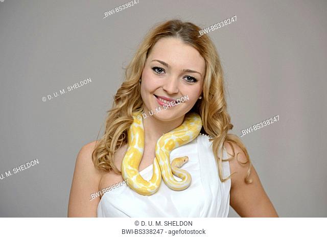 ball python, royal python (Python regius), beauty young woman with a python around her neck