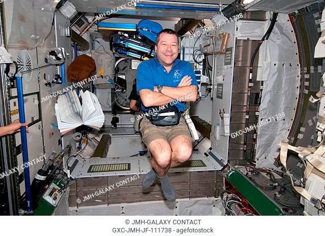 NASA astronaut Nicholas Patrick, STS-130 mission specialist, smiles for a photo while floating freely in the newly-installed Tranquility node of the...