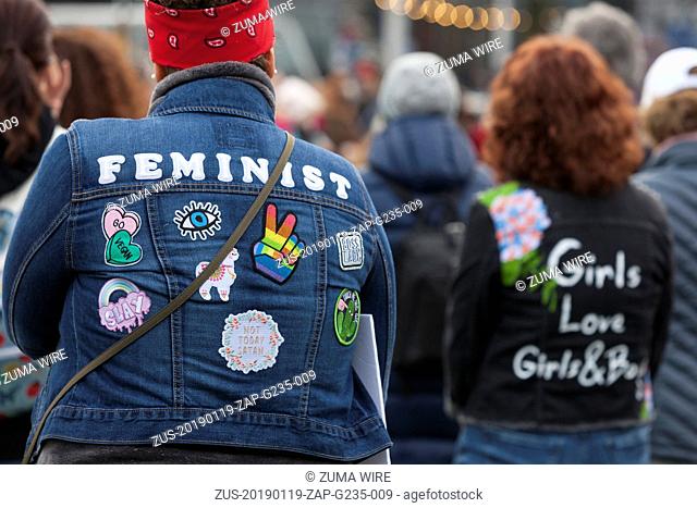 January 19, 2019 - Seattle, Washington, United States - Seattle, Washington: Supporters wear jackets with feminist messages at the pre-march rally at Cal...