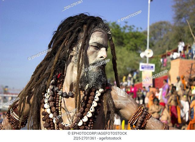 Naga sadhu going for Shahi Snaan (Royal Holy Dip) Kumbh Mela 2016. Ujjain, Madhya Pradesh, India