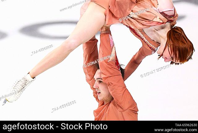 RUSSIA, CHELYABINSK - DECEMBER 21, 2023: Pair skaters Yelizaveta Osokina and Artyom Gritsayenko perform a lift during a pairs' short programme event as part of...