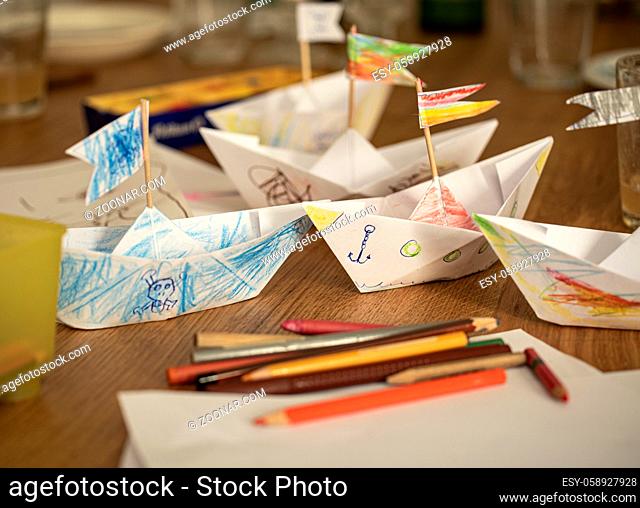 Paper ships made and painted by children