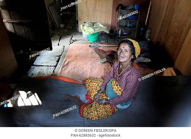 The deaf 72-year old Nepali woman Saili Lati Karki sits in her newly build hut in Pangretar near Kathmandu, Nepal, 19 October 2015
