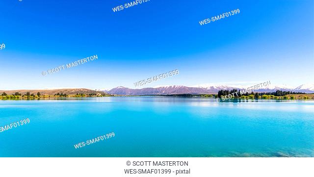 Idyllic shot of Lake Ruataniwha against blue sky, South Island, New Zealand