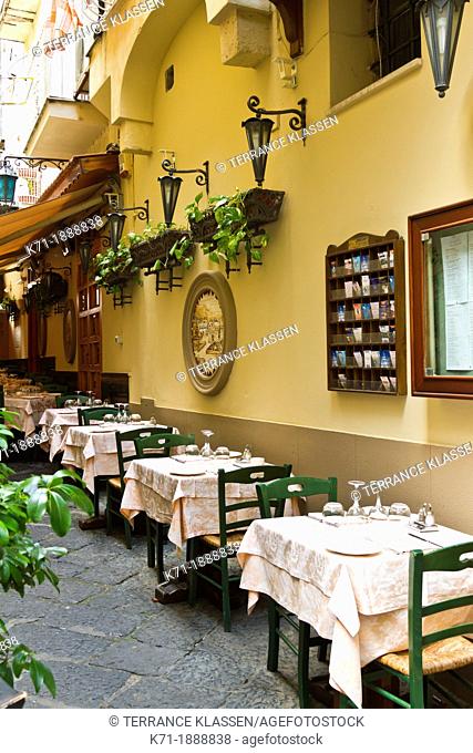 Tables and chairs at an outdoor restaurant in Sorrento, Campania, Italy