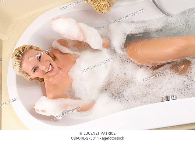 Woman foaming bath