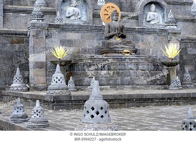Buddha statue on an altar outside of the Buddhist Brahma Vihara Monastery, Banjar, North Bali, Bali, Indonesia