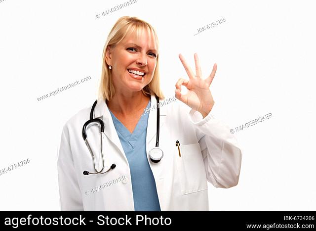 Friendly female blonde doctor or nurse with okay sign isolated on a white background