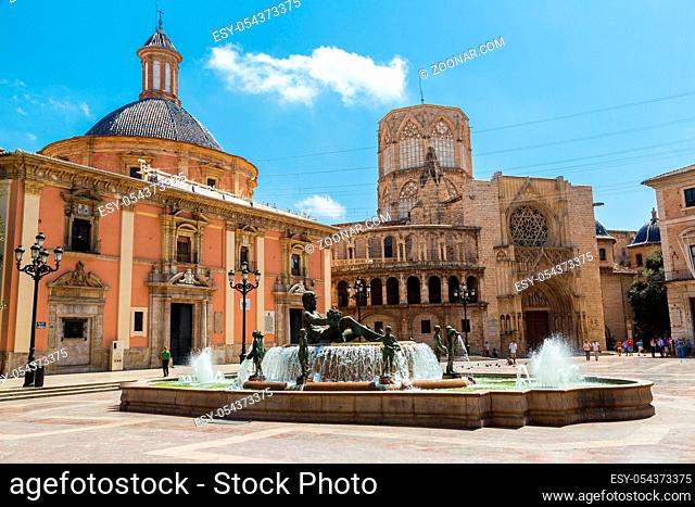 Square of Saint Mary's and fountain Rio Turia in Valencia in a summer day, Spain