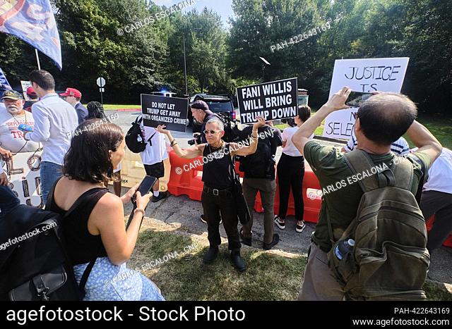 ATLANTA, GA. AUG 24 2023 - Opponents of former US President Donald J. Trump gather outside Fulton County Jail in Atlanta