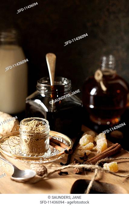 Ingredients for making gingerbread cream liqueur on a wooden board