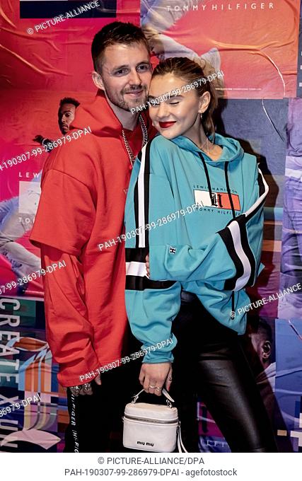 07 March 2019, Berlin: Marcus Butler, influencer, and Stefanie Giesinger, model, stand in front of a photo wall at the Tommy Hilfiger CREATExUNITY event