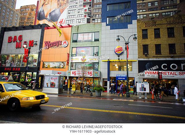 Wendy's and Burger King fast food restaurants are almost next to each other on West 34th Street in New York According to market research Wendy's is about to...
