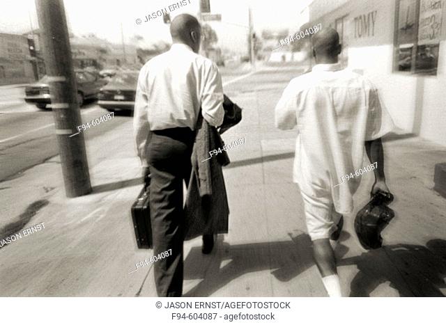 Two men walking, digitally manipulated image